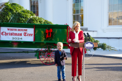 Presidential grandson Beau Biden joins the First Lady at the arrival of the White House Christmas Tree.