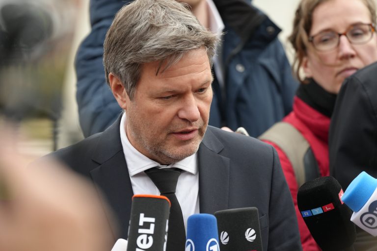 German Economic Minister Robert Habeck addresses the press near the White House.