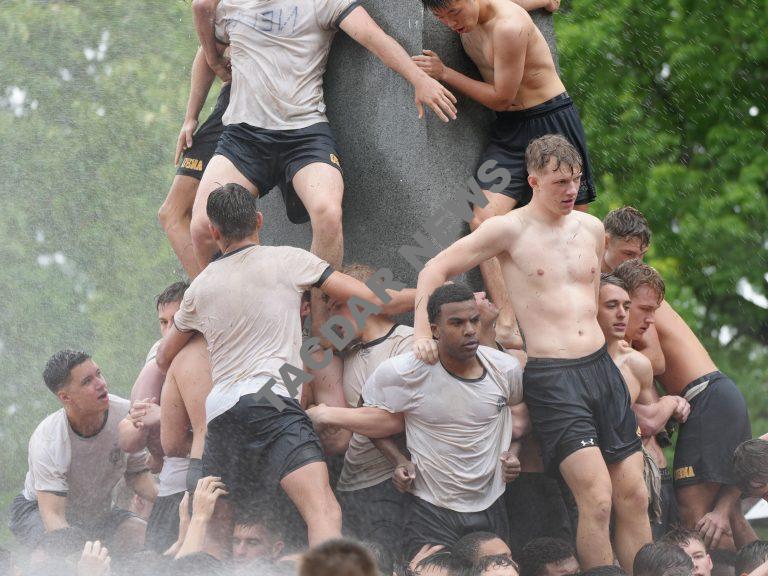 Naval Academy Plebes climb Herndon, signifying the end of the first year.